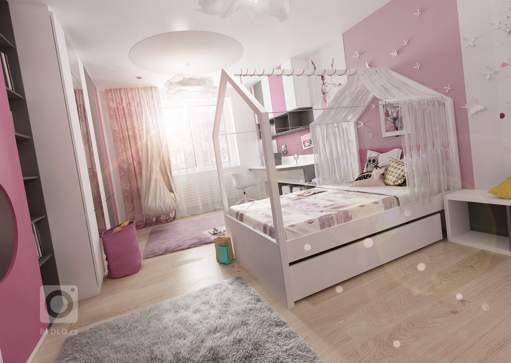 Dva pokoje pro dvě sestry vzájemně propojené průchodem skrz skříně. Pokoj starší dívky je v&nbsp;růžové, antracitové a bílé barvy. Nad postelí je rámová…