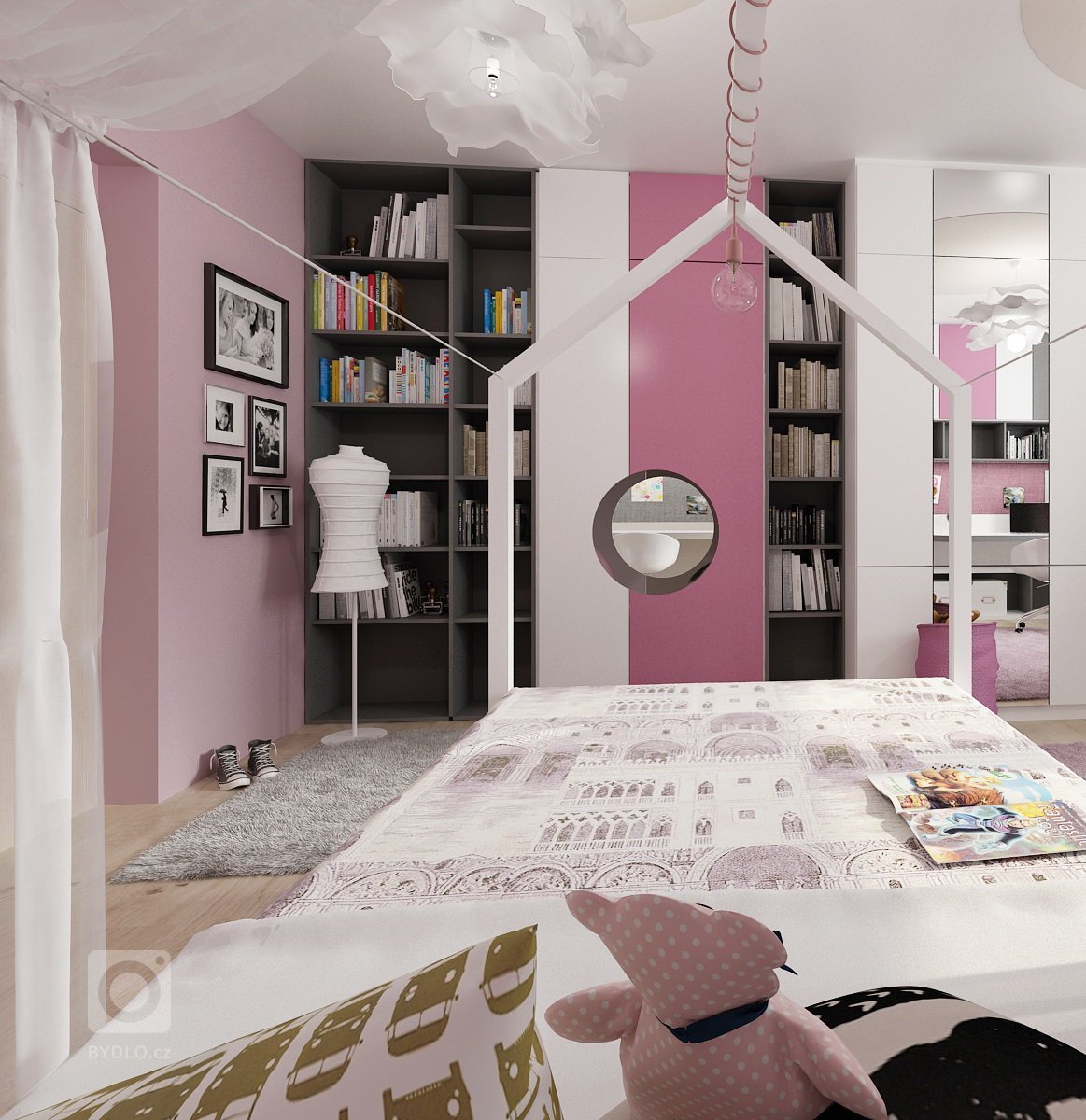 Dva pokoje pro dvě sestry vzájemně propojené průchodem skrz skříně. Pokoj starší dívky je v&nbsp;růžové, antracitové a bílé barvy. Nad postelí je rámová…