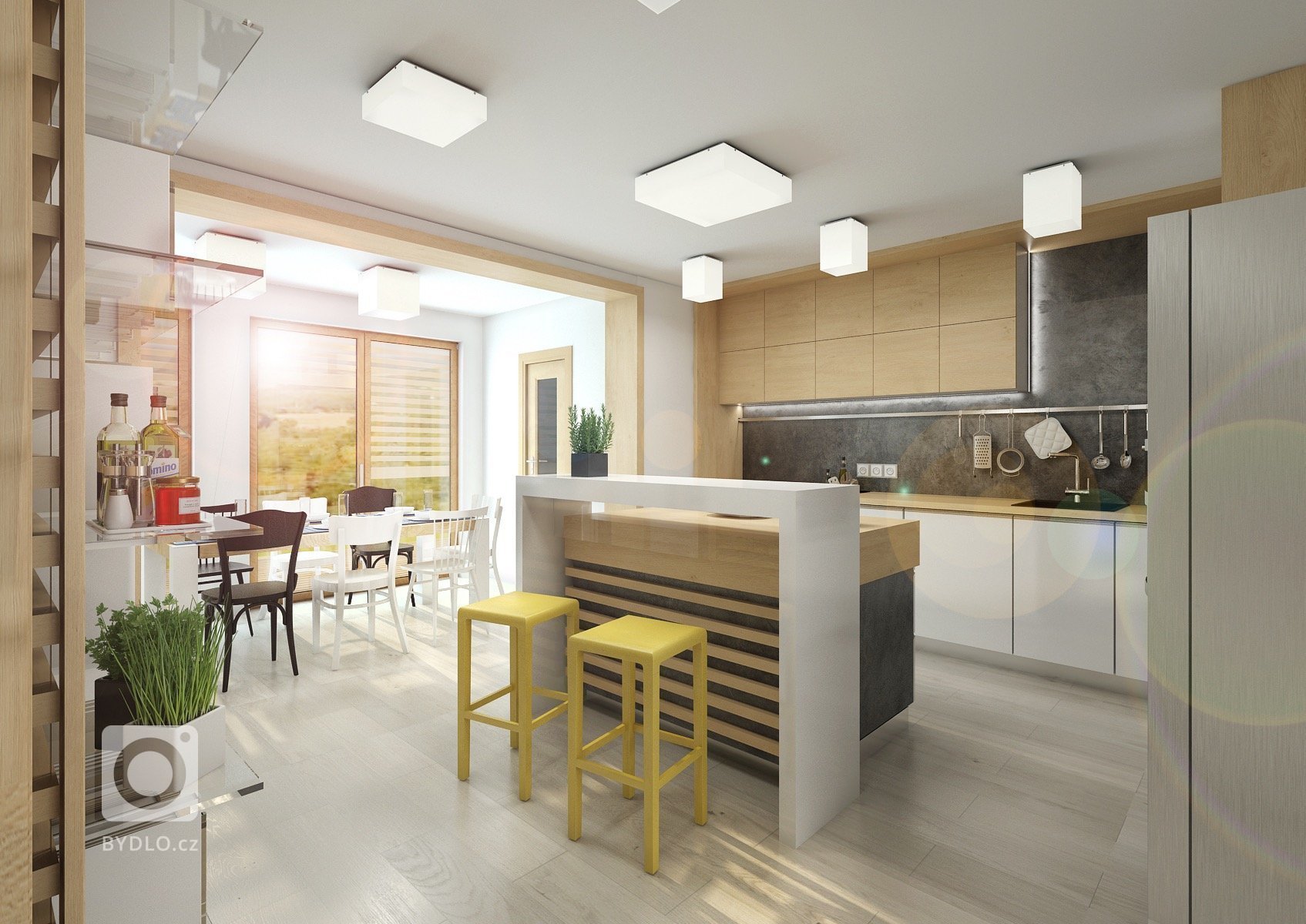 Kuchyně v RD nedaleko Brna. U kuchyňské linky je na stěně černá stěrka, která se opakuje i na dalších stěnách interiéru. Prac. deska a nábytek v dekoru…