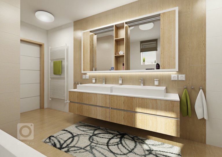 Návrh velkého společného prostoru s kuchyní a obývacím pokojem. Podlaha v šedém dřevodekoru je společná pro celý dům a jednotlivé místnosti se tak více spojují…