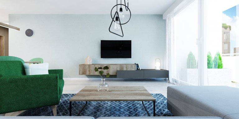 Interiér v zemitých farbách s akcentujúcou zelenou v projekte Rezidencie pri Mýte v Bratislave
