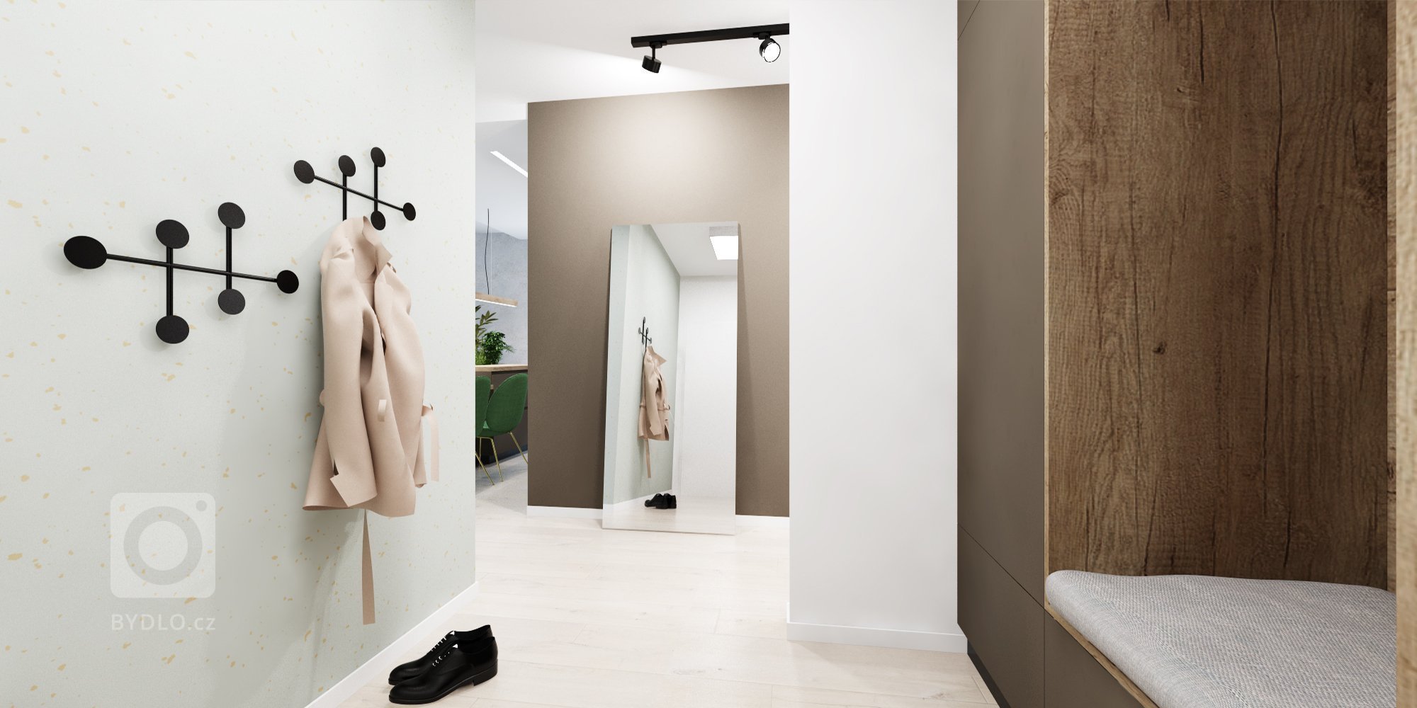 Interiér v zemitých farbách s akcentujúcou zelenou v projekte Rezidencie pri Mýte v Bratislave
