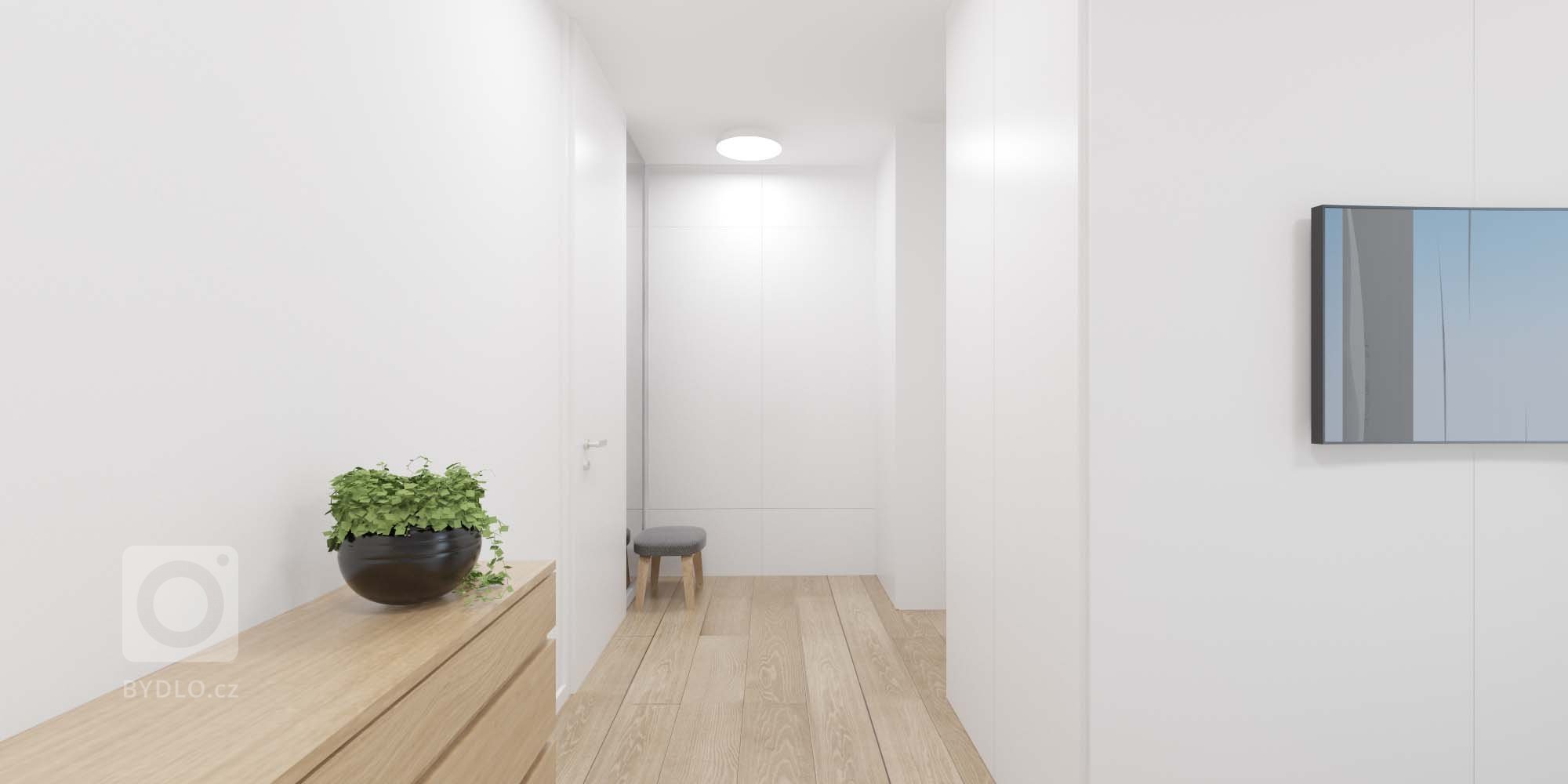 Minimalistický interiér s akcentujúcimi doplnkami.
