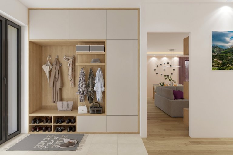 Vstupní předsíň ve které je dostatek úložného prostoru i místo na sezení.