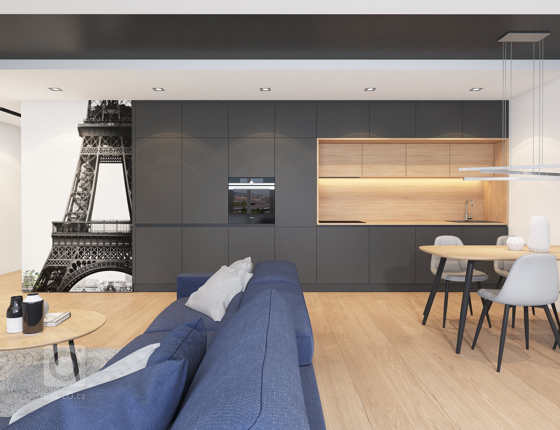 Návrh interiéru bytu pro mladého muže. V interiéru převládá kombinace antracitové barvy s bílou, světlým dřevodekorem a šedou. Doplňkou barvou je tmavě modrá,…